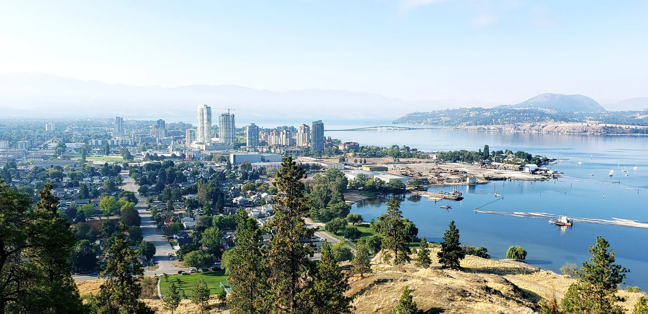 Wide panoramic view of the city of Kelowna BC on the shore of Okanagan